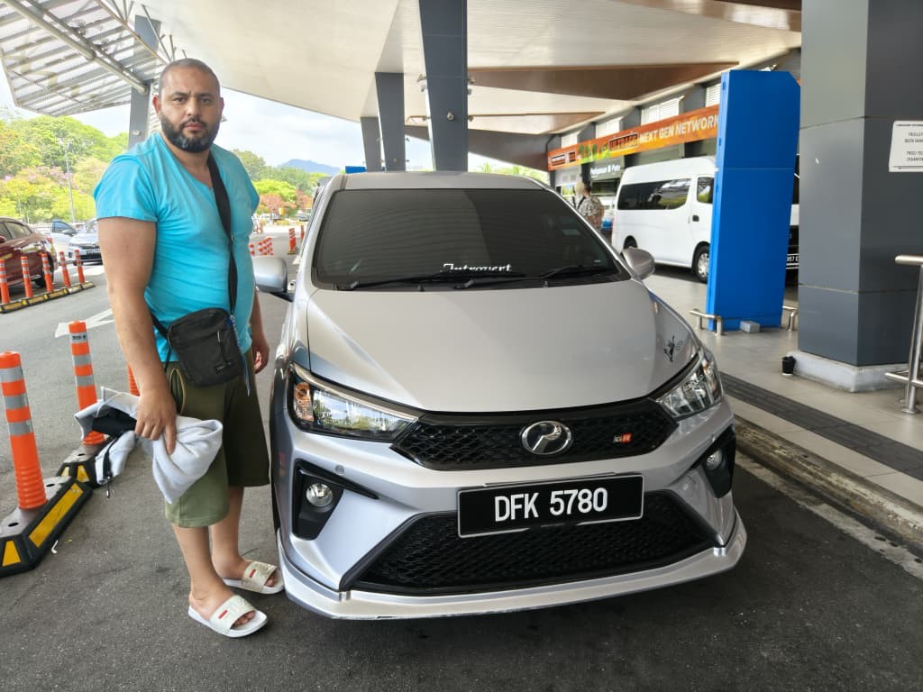 Customer with a silver Perodua Axia