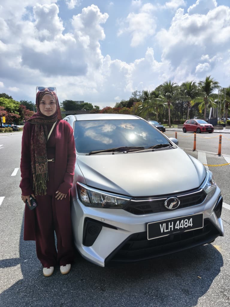 Customer with a silver Perodua Bezza
