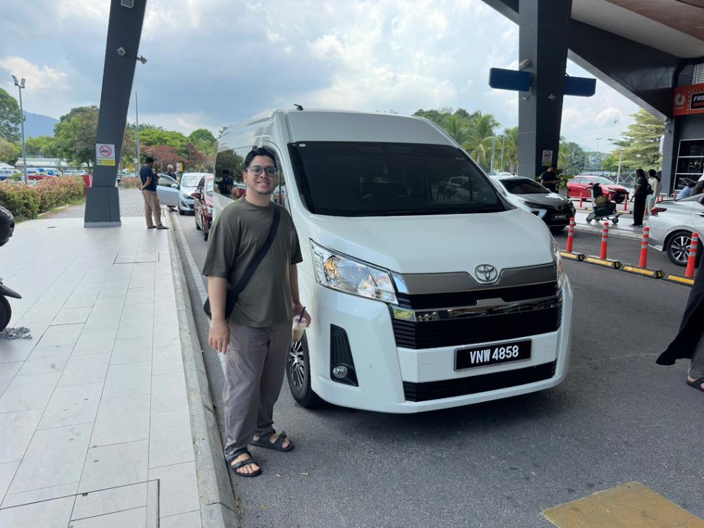 Customer with a white Toyota van